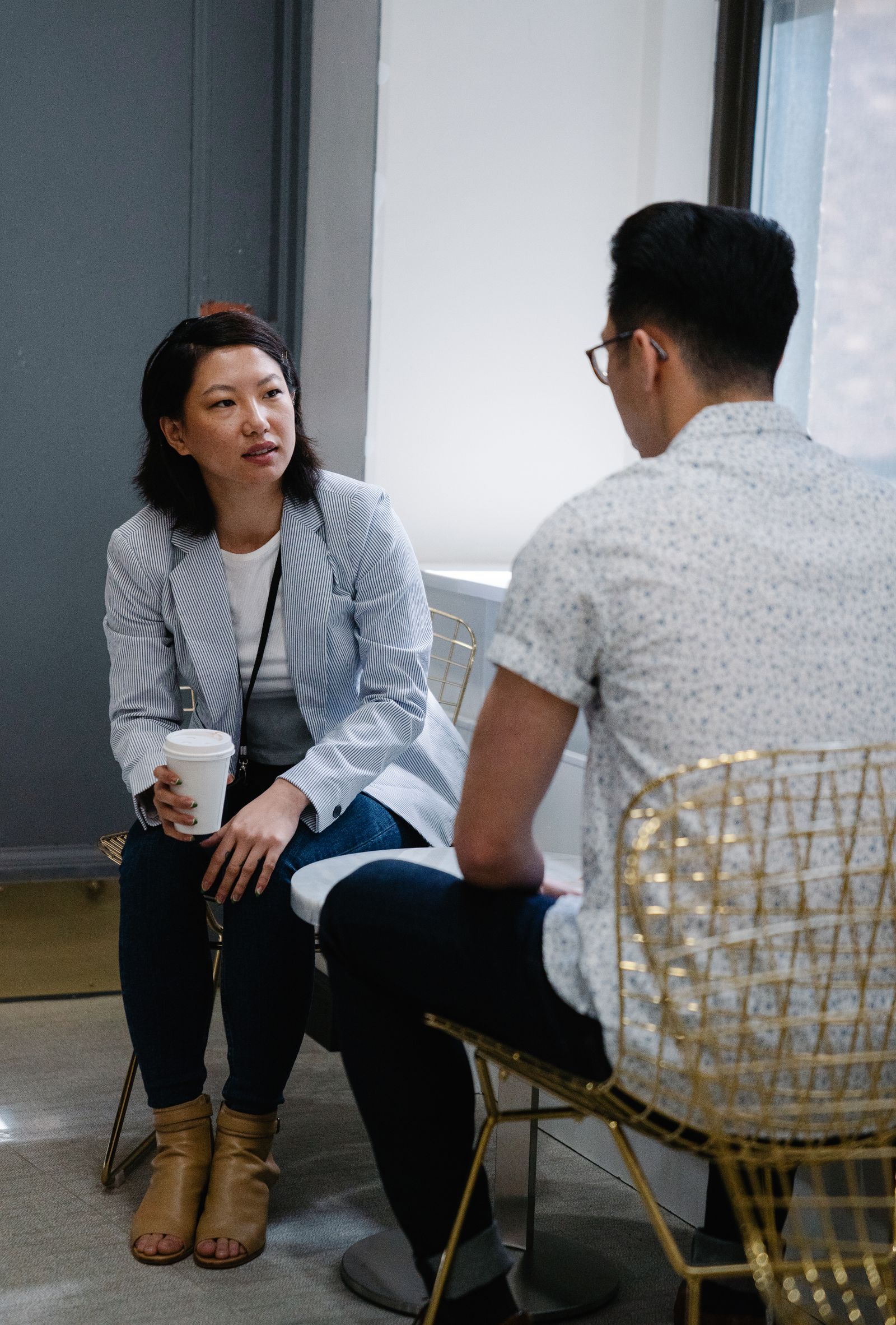 A supportive one-on-one conversation in a workplace setting