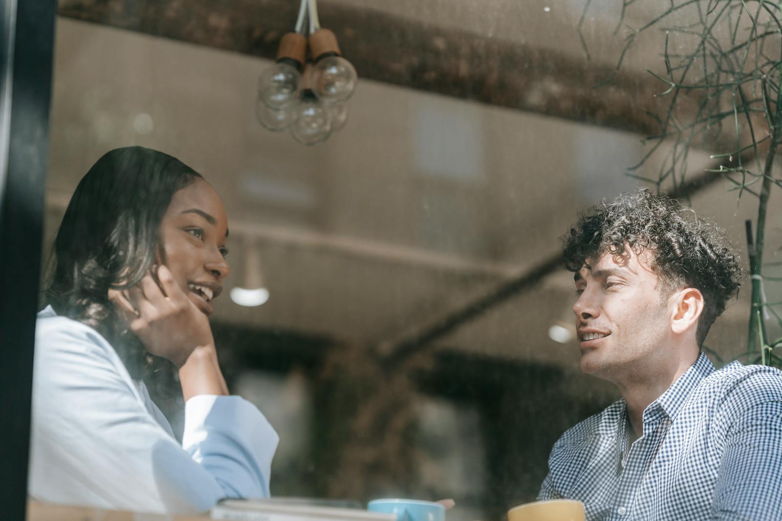 Two colleagues in a warm, candid conversation